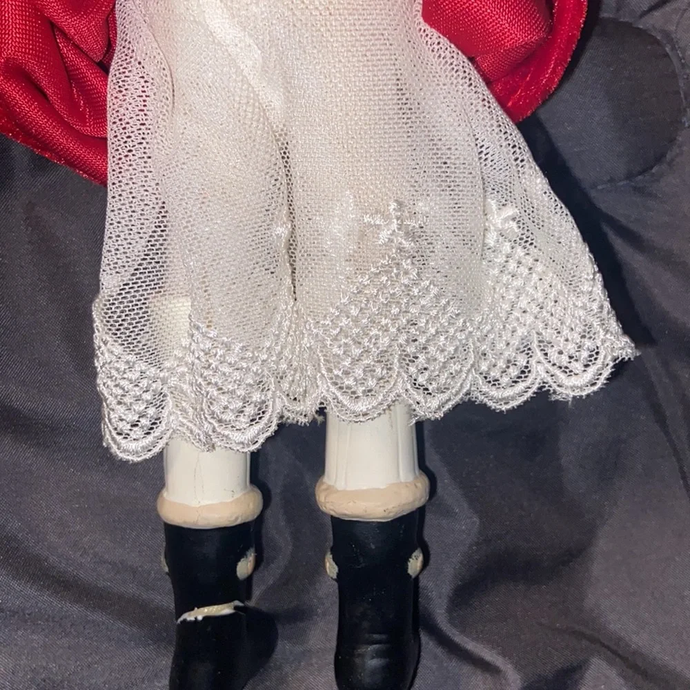Vintage African American doll ornament with red velvet and leopard fur purse